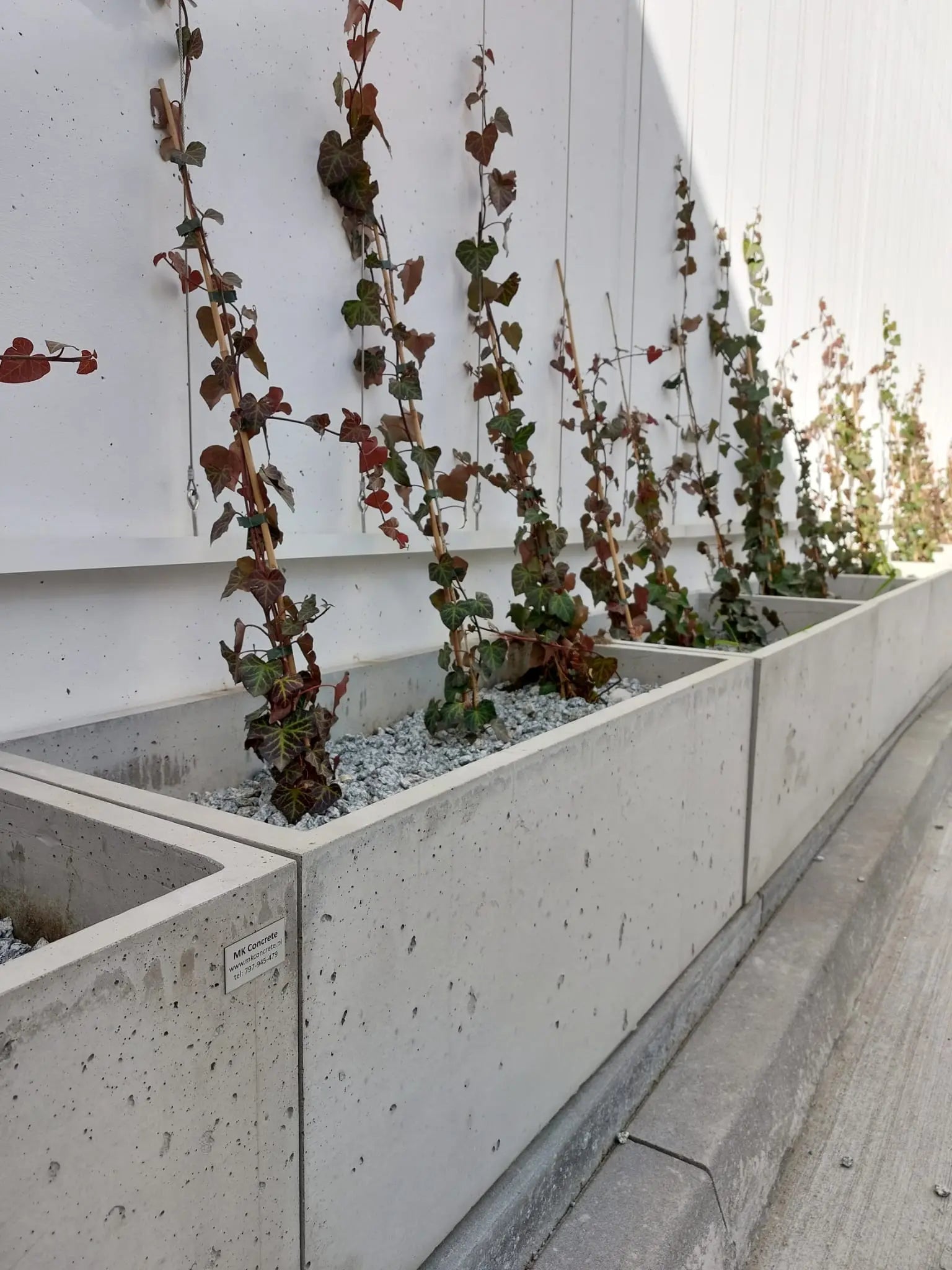 Outdoor Concrete Planters - Rectangle 50x120x50 cm in front of a building Decormania.eu